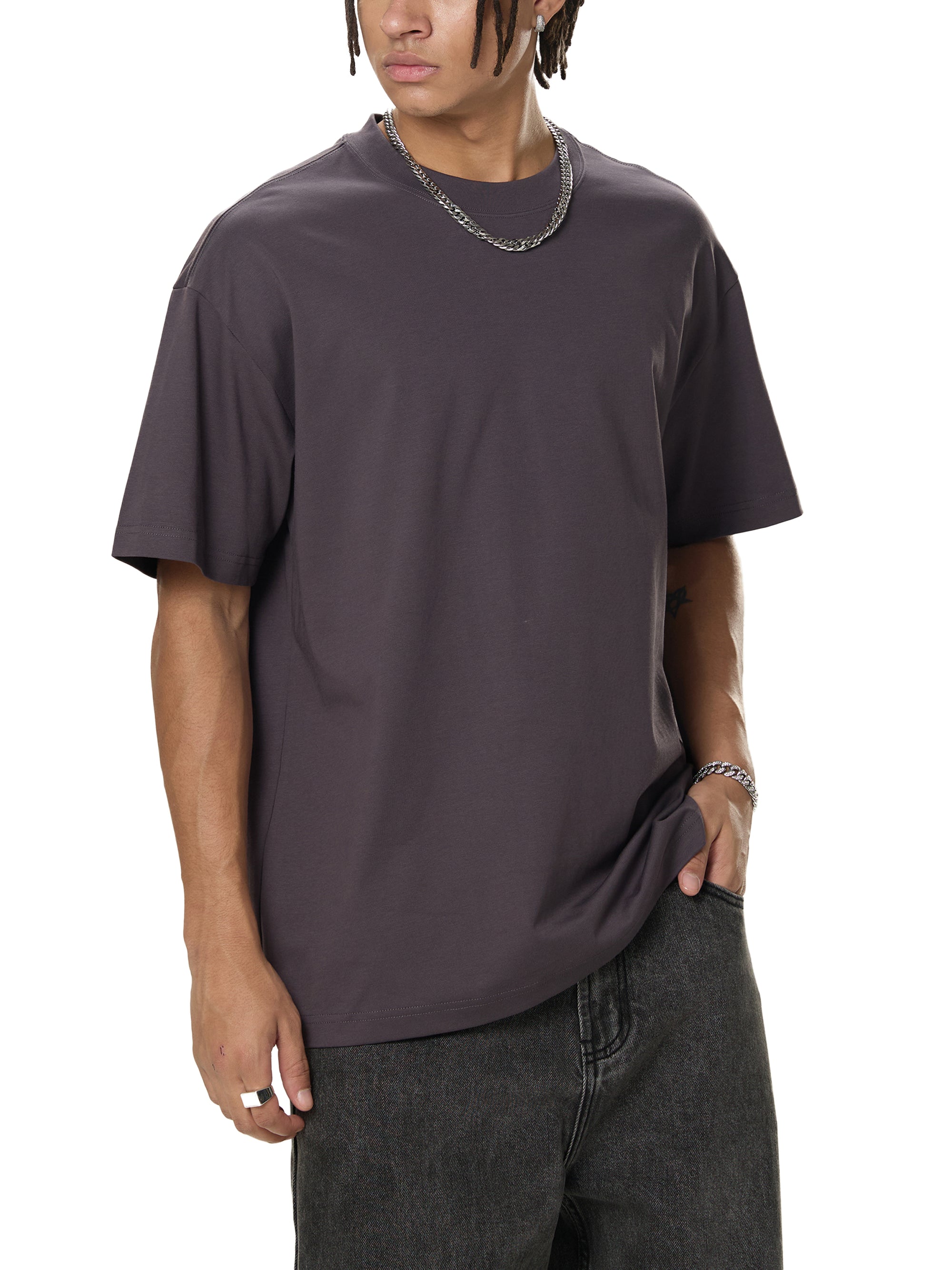 Person wearing a dark gray t-shirt on a white background